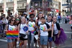 Students and staff of Montclair State posing for a picture at a parade.